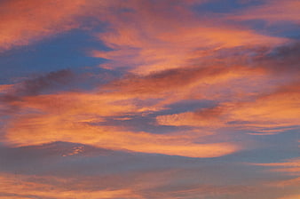 Vibrant Orange and Pink Sunset Clouds in Blue Sky