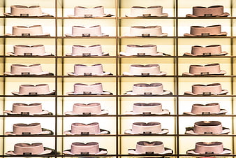 Grid of luxury Eton shirt collars on illuminated shelves