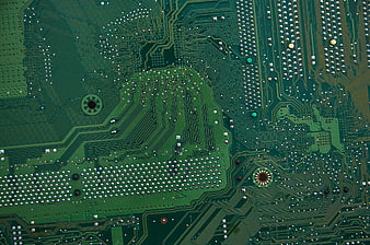 Close-up of green circuit board with electronic components