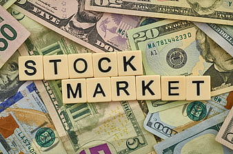 Stock Market Scrabble Tiles on US Dollar Bills