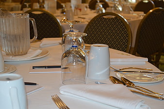 Formal Conference Table Setting With White Linens And Glassware