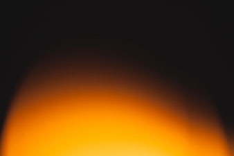 Abstract Blurred Orange and Black Gradient Background