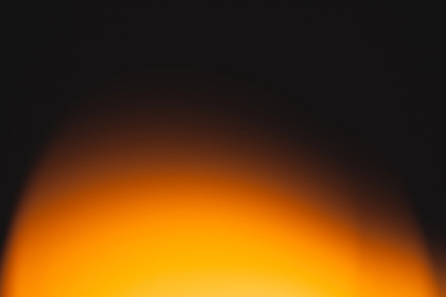 Abstract Blurred Orange and Black Gradient Background