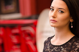 Elegant young brunette woman portrait with black lace top