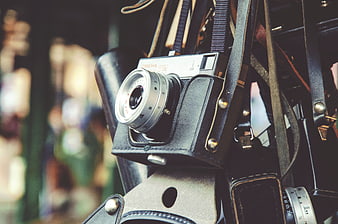 Vintage Film Camera in Leather Case Hanging on Strap