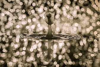 Sepia Water Droplet Splash with Bokeh Background