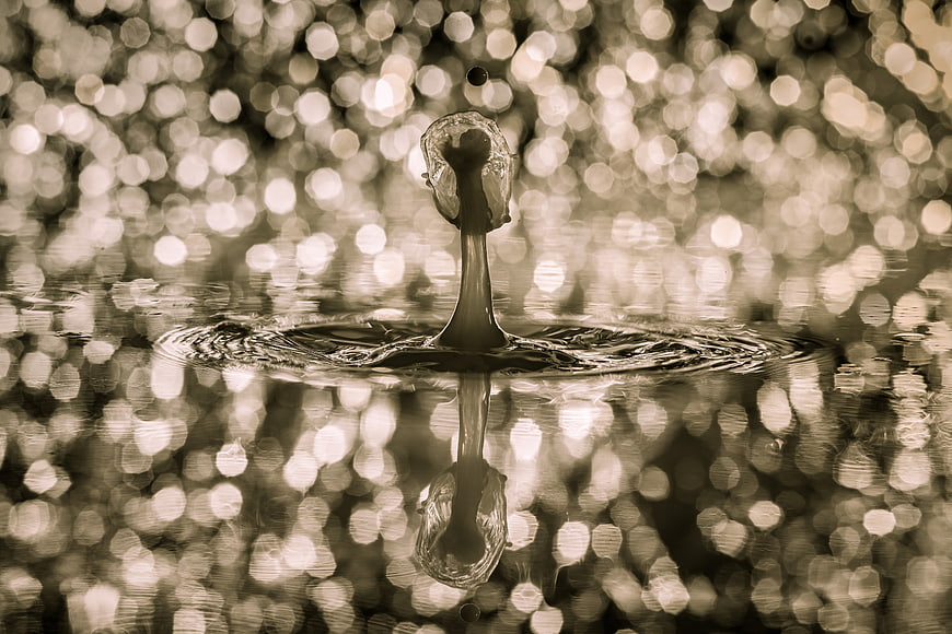 Sepia Water Droplet Splash with Bokeh Background