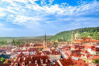 Panoramic View of Prague Downtown with Red Roofs and Blue Sky
