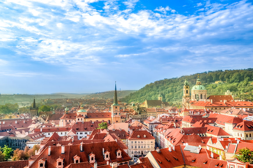 Panoramic View of Prague Downtown with Red Roofs and Blue Sky