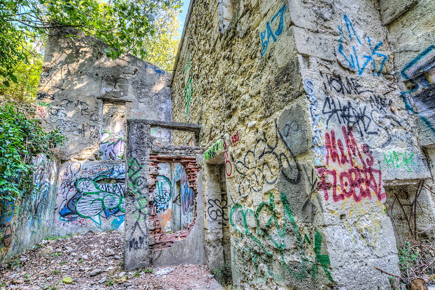 Abandoned concrete ruins covered in colorful graffiti art