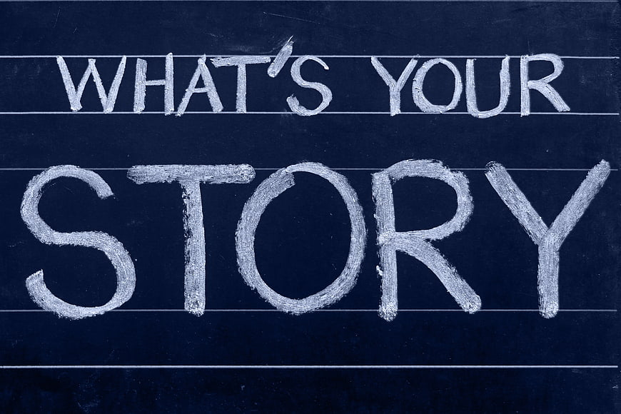 What's Your Story Written in Chalk on Blue Blackboard
