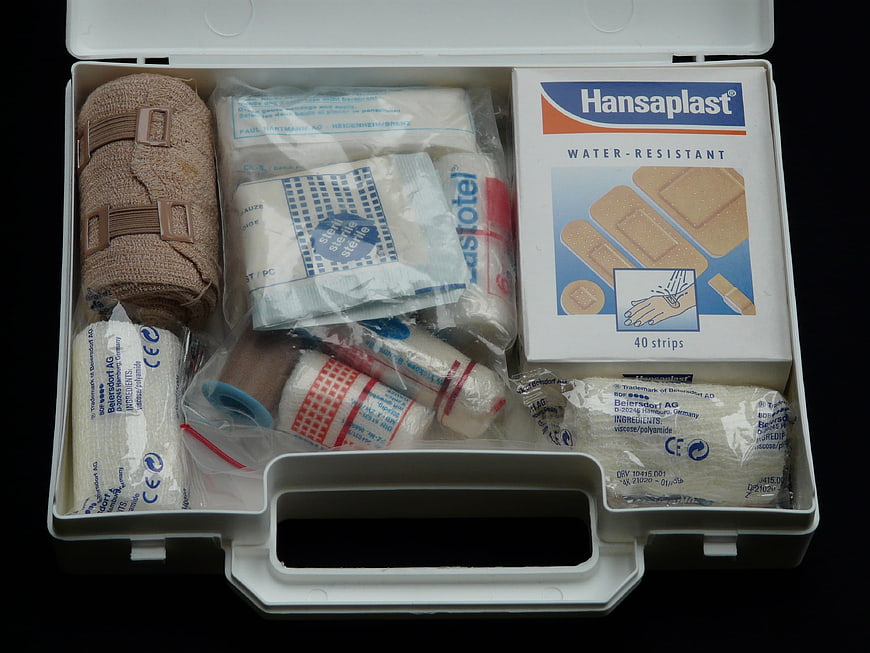 Open First Aid Kit with Bandages and Medical Supplies