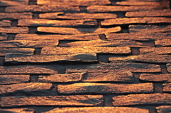 Warm Golden Light On Textured Cobblestone Pavement Surface