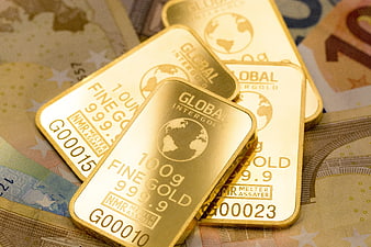 Gold bars on euro banknotes investment concept