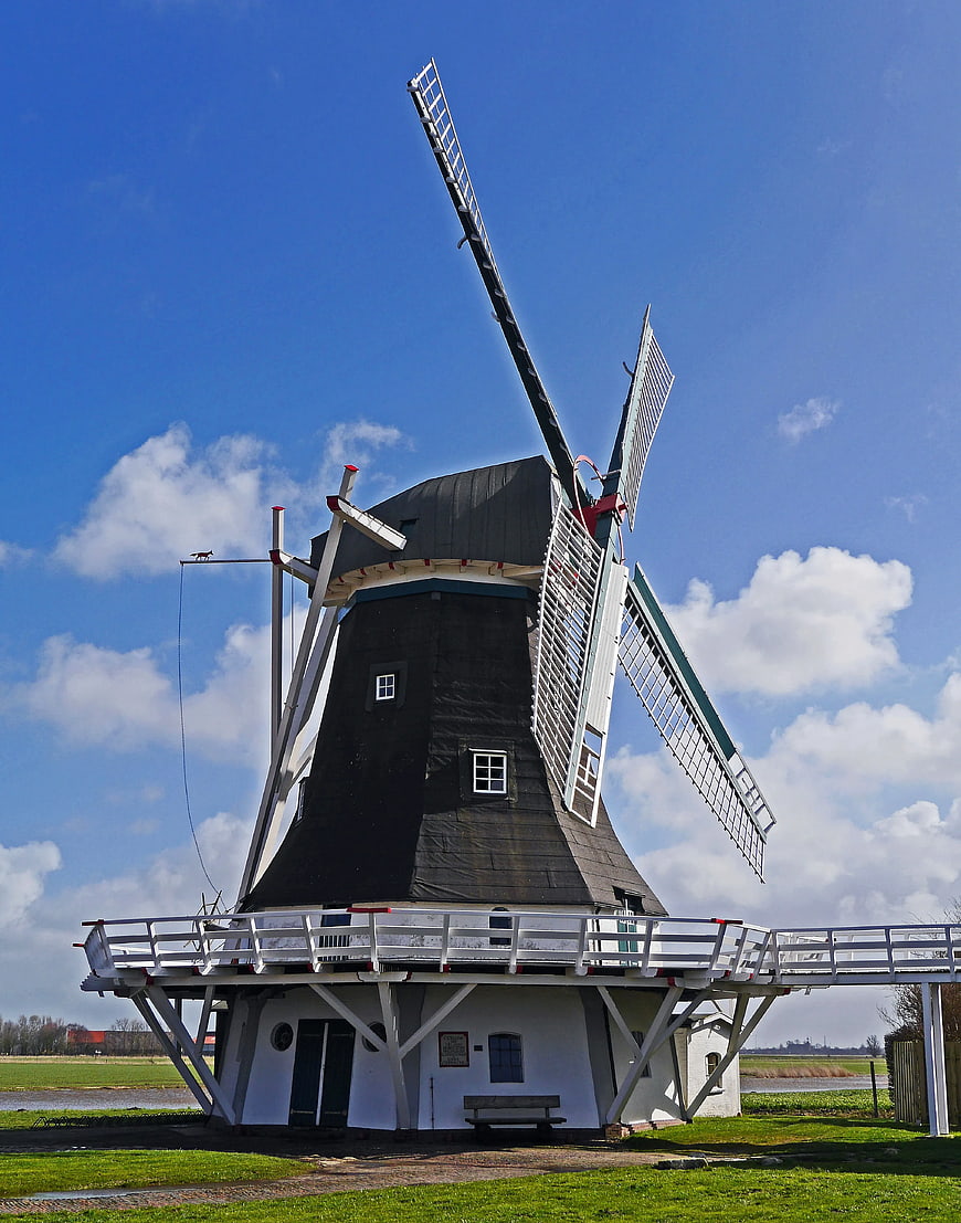 Traditional Dutch Windmill on Sunny Day