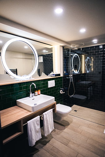 Modern Bathroom Interior with Green Tiles and Wooden Vanity