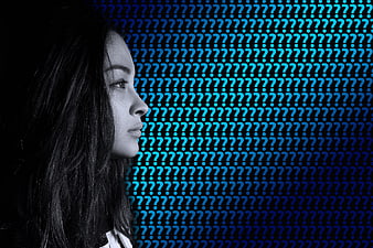 Woman Profile Against Blue Question Mark Background
