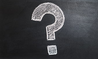 White Chalk Question Mark on Blackboard