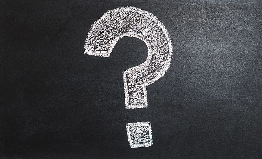 White Chalk Question Mark on Blackboard