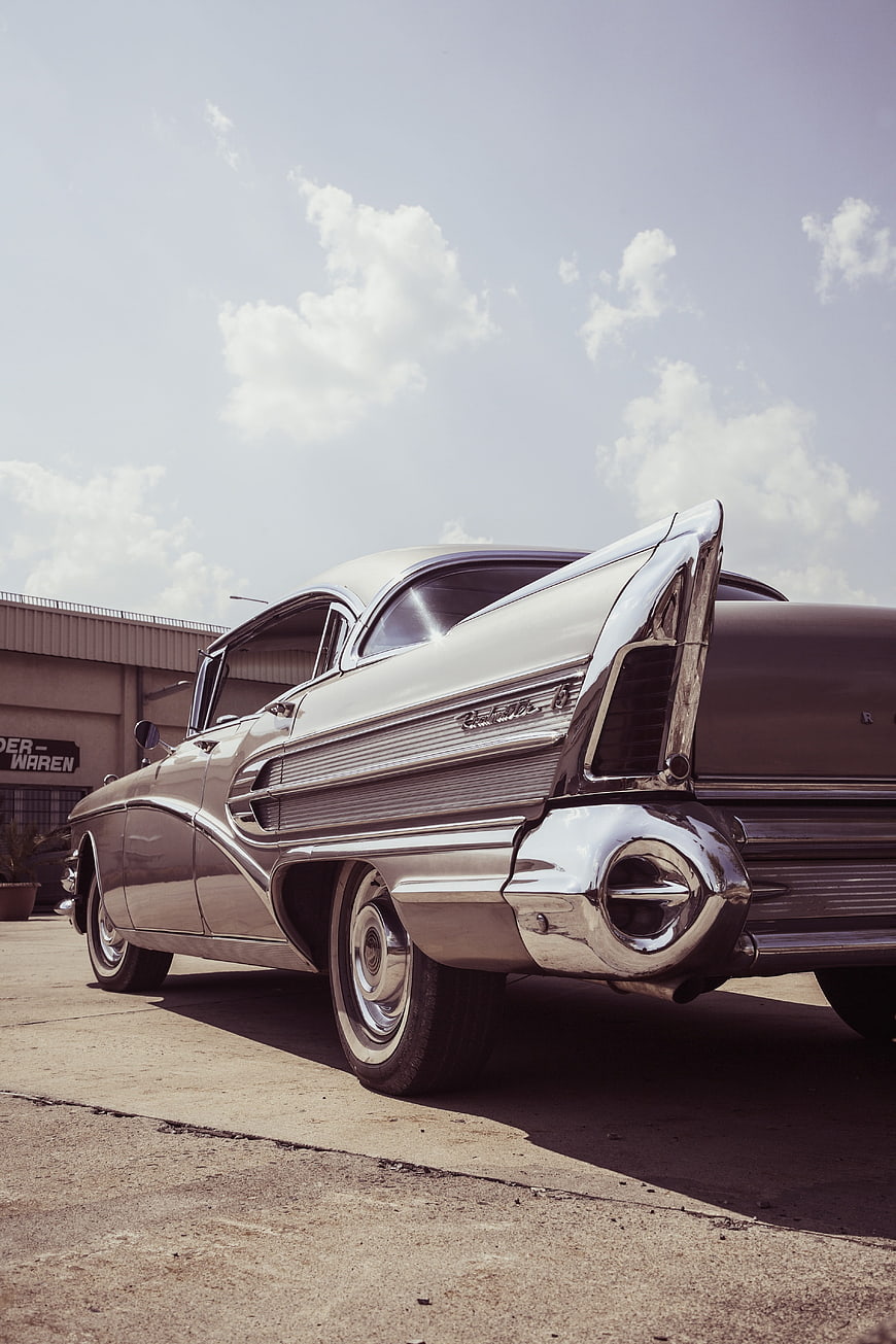 Rear View of Classic Silver Cadillac with Tail Fins