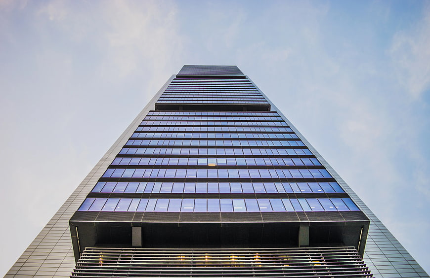 Worm's Eye View of Modern Glass Skyscraper