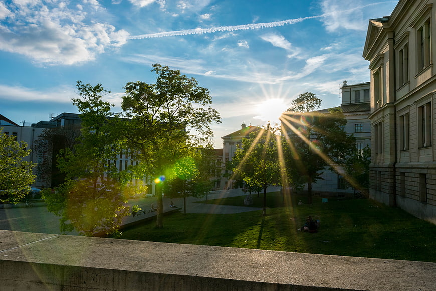 Sunburst Over University Campus Green Space In Germany