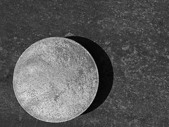 Monochrome textured circle on grunge background