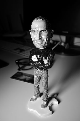 Black and White Steve Jobs Bobblehead on Desk