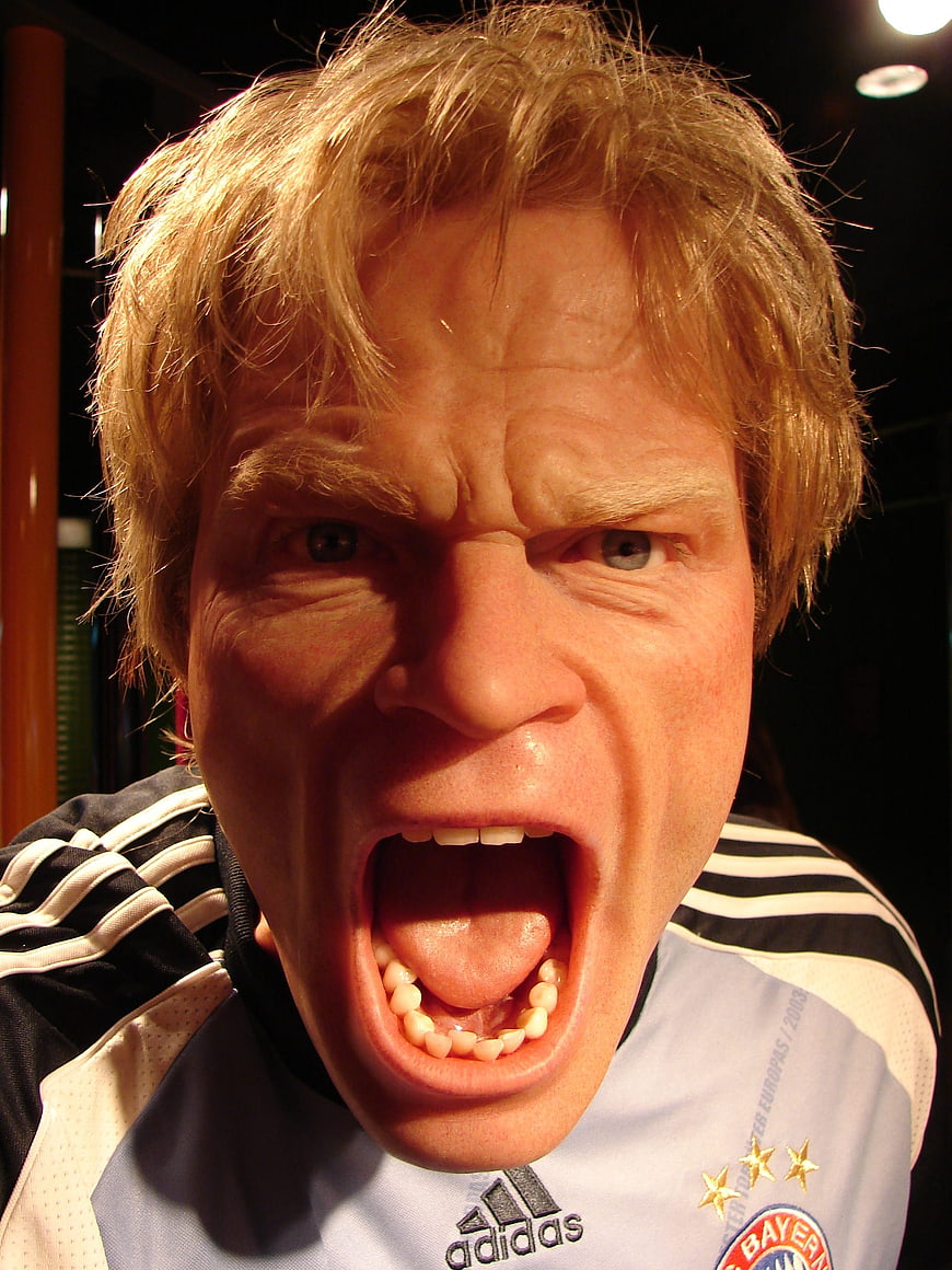 Angry screaming man in football jersey close-up