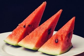 Three Slices of Fresh Red Watermelon on White Plate