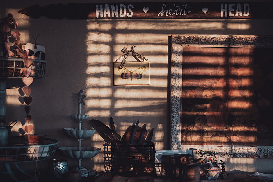 Rustic interior wall with sunlight shadows and vintage decor
