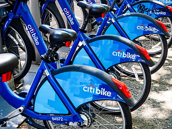 Row of Blue Citi Bike Bicycles Parked on Sidewalk