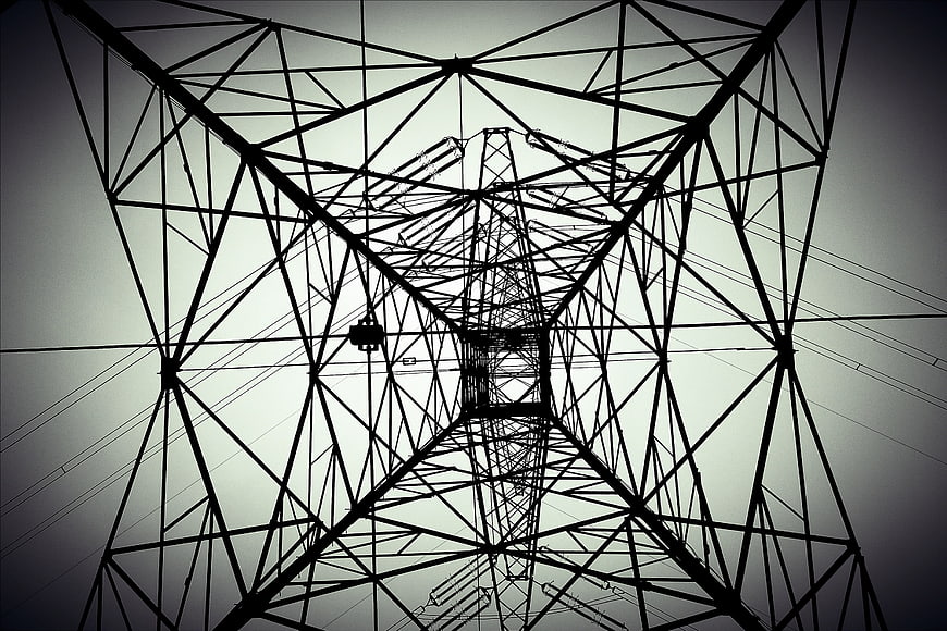 Low angle view of high voltage electricity pylon structure