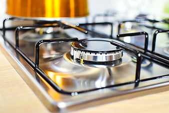 Close-up of modern stainless steel gas stove burner