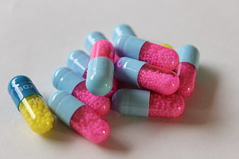 Colorful Medicine Capsules with Pink and Yellow Beads