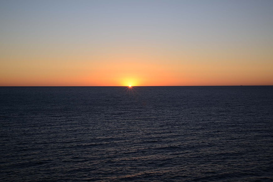 Sunrise Over Calm Ocean Horizon