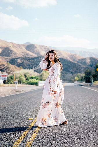 Woman in Floral Maxi Dress Standing on Mountain Road
