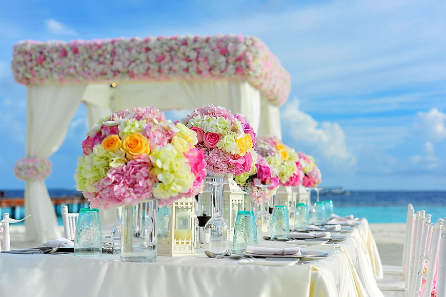 Beach Wedding Reception Table with Floral Centerpieces