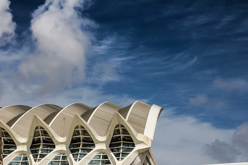 Modern White Architectural Roof Against Blue Sky