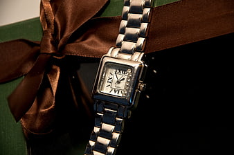 Silver Watch on Green Gift Box with Brown Ribbon