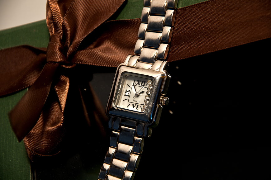 Silver Watch on Green Gift Box with Brown Ribbon