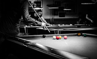 Selective Color Pool Game in Dimly Lit Bar