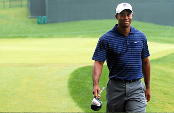 Tiger Woods Walking on Golf Course with Club