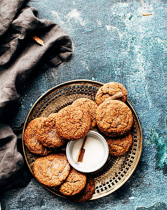 Top view of homemade ginger cookies on a vintage brass tray