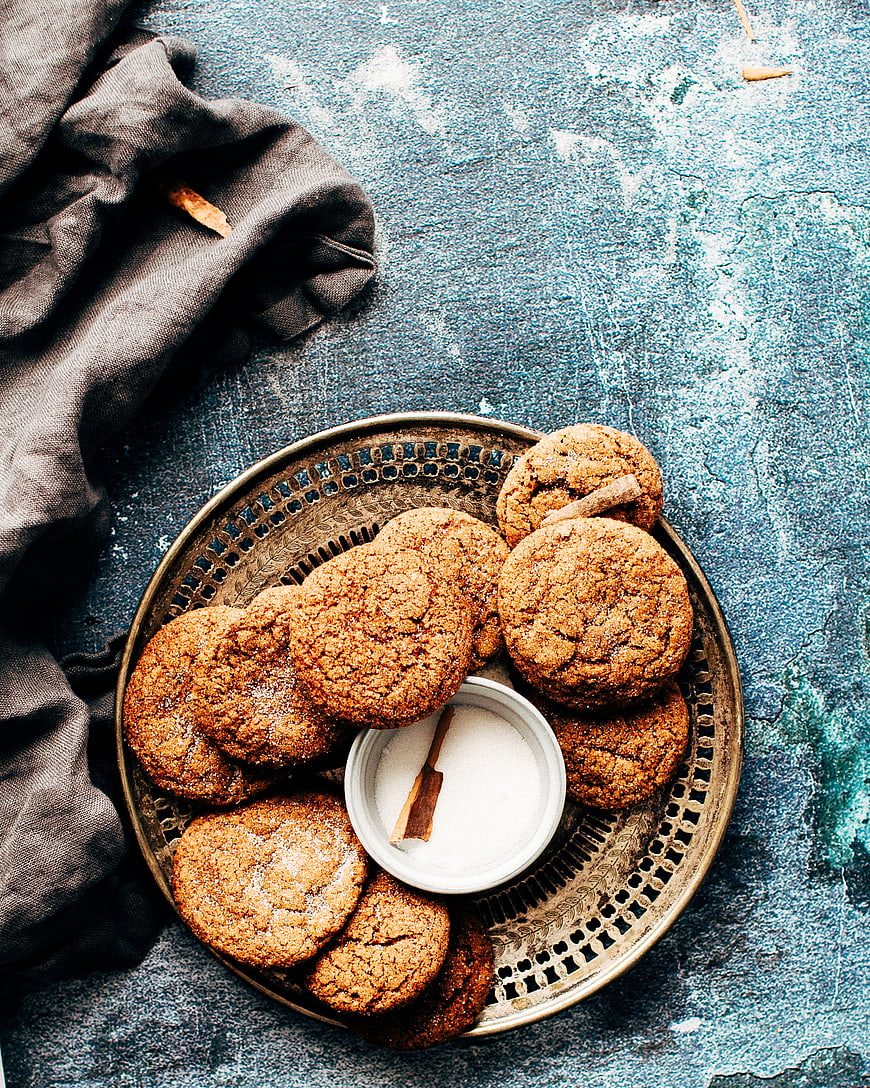 Top view of homemade ginger cookies on a vintage brass tray