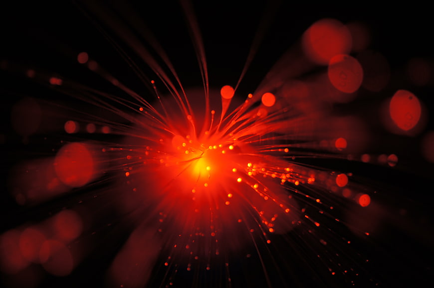 Abstract Red Fiber Optic Light Burst on Black Background