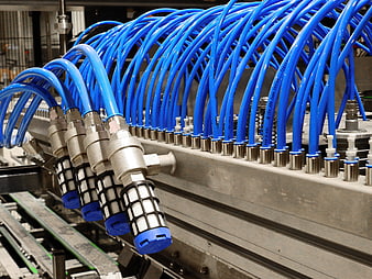 Industrial Pneumatic System With Blue Hoses And Metal Connectors