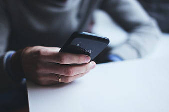 Close-up of hand holding black Nexus smartphone