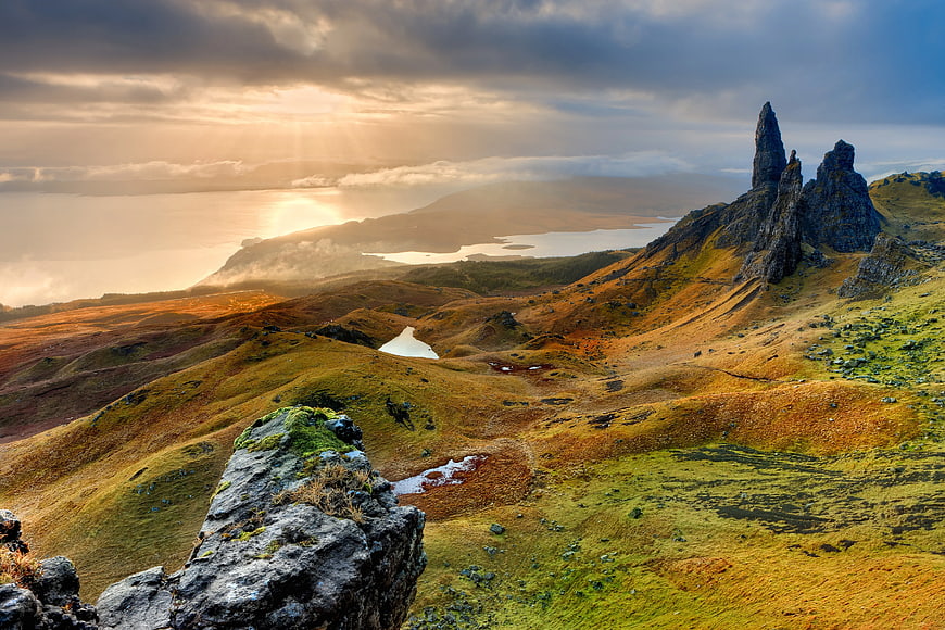 Dramatic Sunset Over Old Man of Storr Rock Formation in Scotland