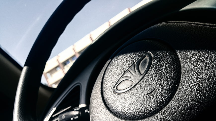 Close-up of Chrysler steering wheel with logo